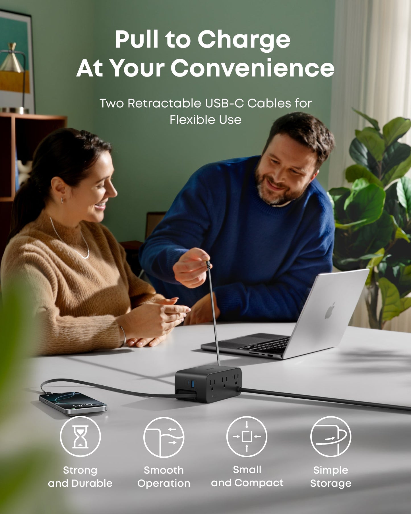 A woman and man smile at a table with a laptop and phone as the man pulls a retractable USB-C cable from the Anker Nano Charging Station (7-in-1, 100W). Icons highlight its durability, smooth use, compact size, and easy storage.