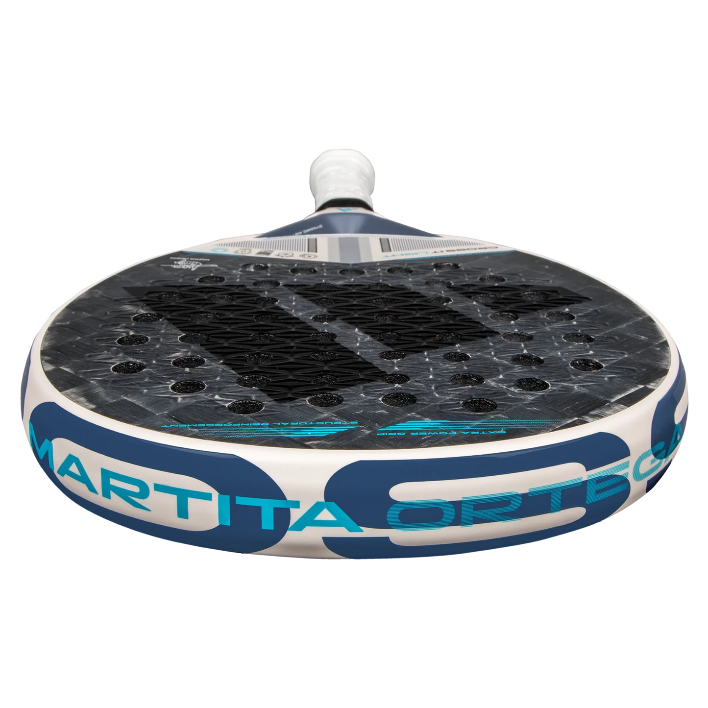 Close-up of the Adidas Cross It Light 3.4 2025 padel racket by Padel USA, lying flat with a black hexagonal face, bold blue stripes, MARTITA ORTEGA in blue on the white edge, and a white grip-wrapped handle.