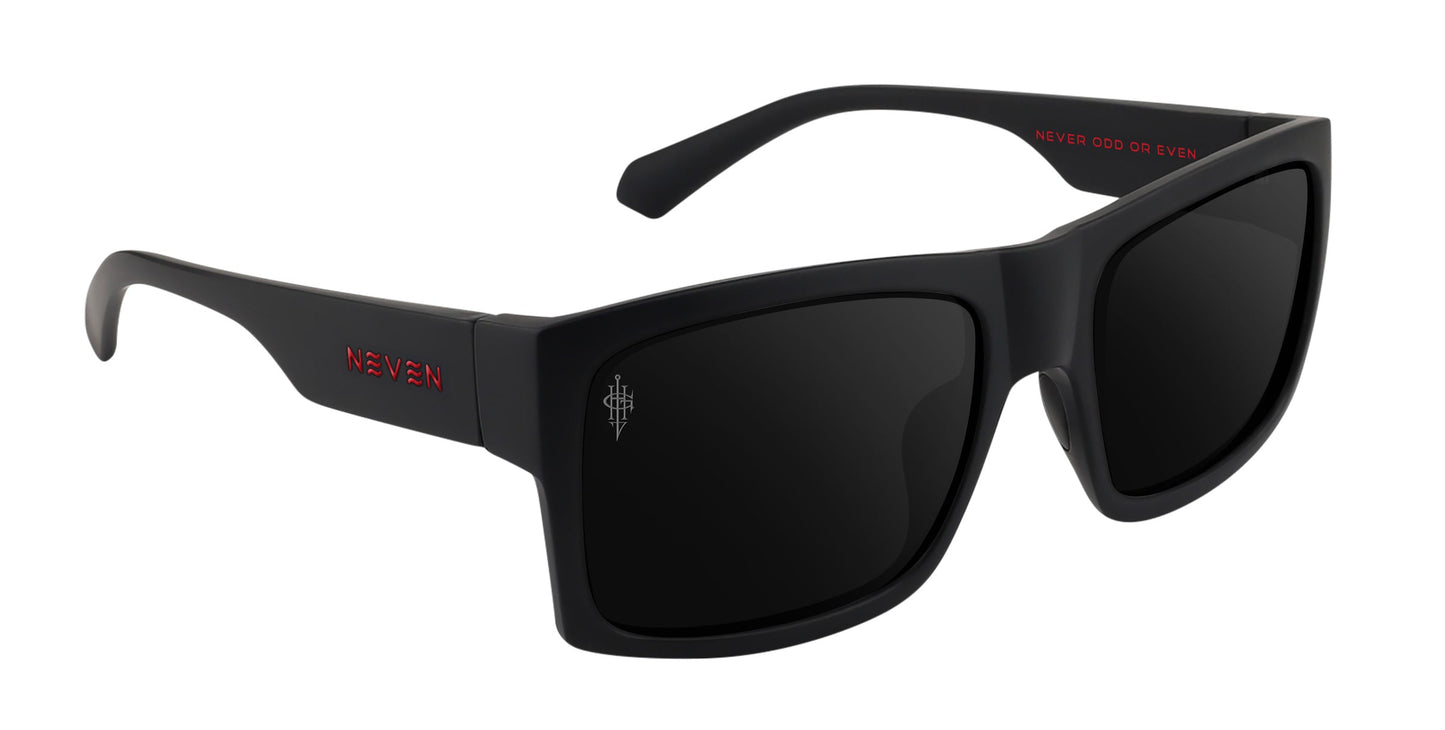 The Redrum by Neven Eyewear: matte black rectangular sunglasses with thick frames. Left arm bears "NEVEN" in red, inner right arm says "NEVER ODD OR EVEN," and a small white symbol appears on the left lens. Polarized lenses available.