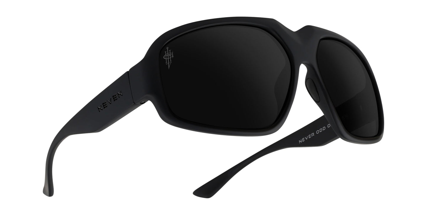 A pair of Neven Eyewear DOA Gary Holt signature sunglasses in matte black with large rectangular polarized lenses. “NEVEN” appears in silver on the left temple arm, plus a small white design near the hinge for added style.