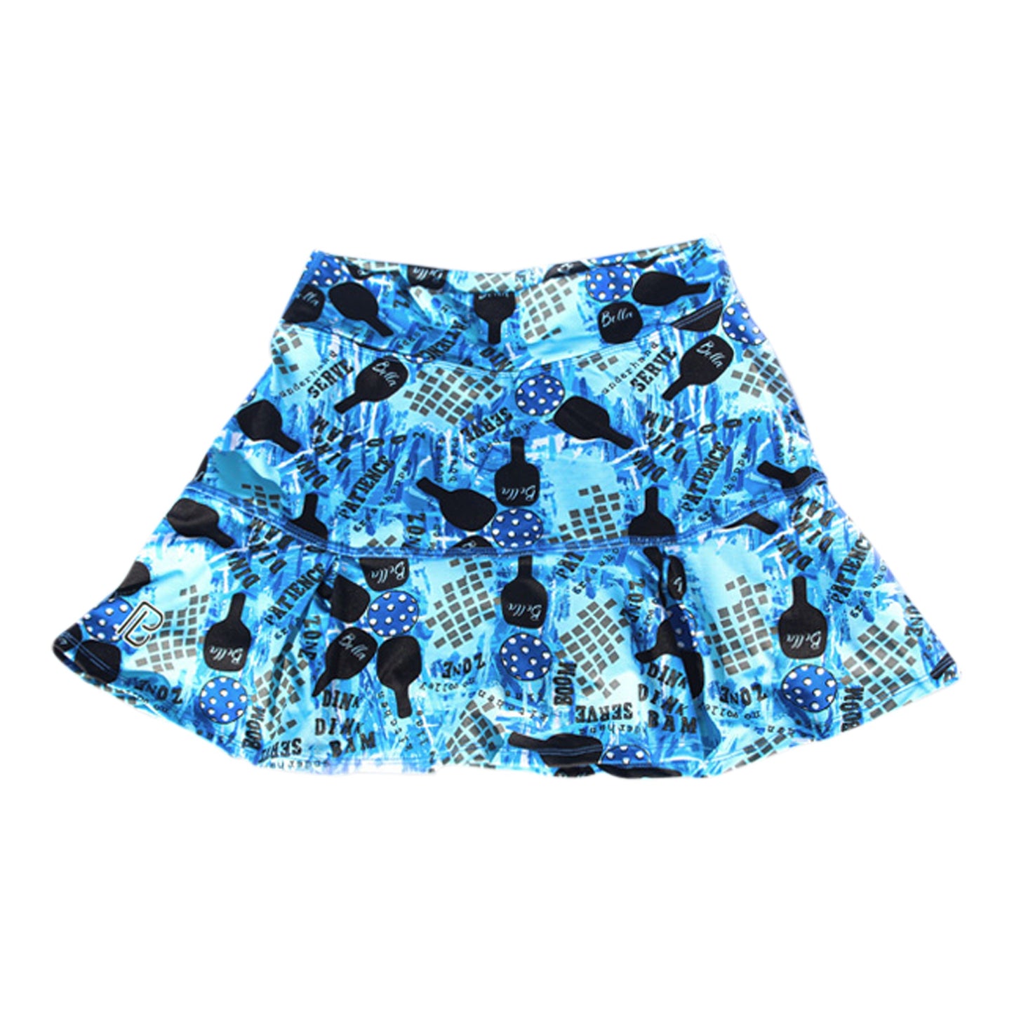 The Pickleball Bella PB Drop Pleat Skort Graffiti 2 is a blue, tiered skort for girls with an abstract print of black guitars, blue polka dots, and fun words. Its flared hem enhances the vibrant, energetic look.