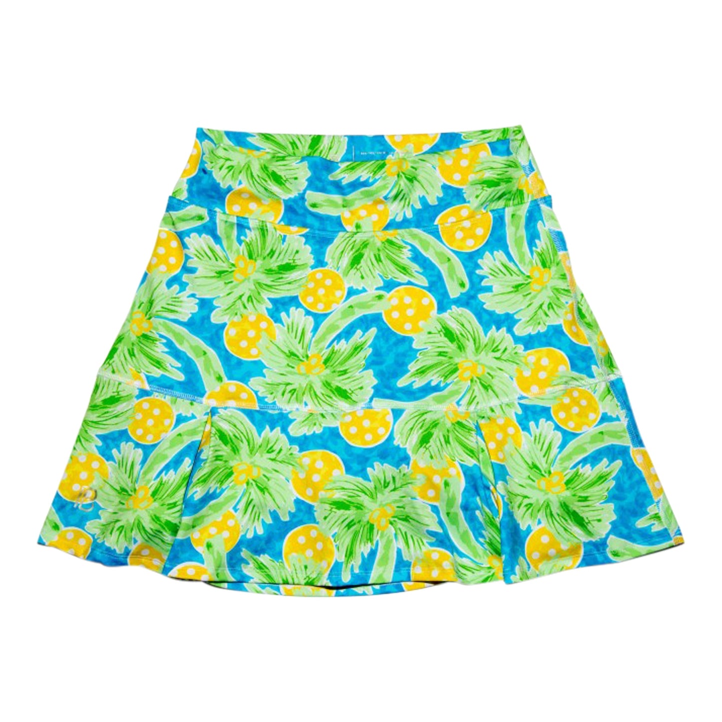 The Pickleball Bella PB Drop Pleat Skort Palms 1 features a vibrant tropical print with green palms and yellow-orange fruits on bright blue, soft pleats near the hem, and a smooth waistband, shown laid flat on a white background.