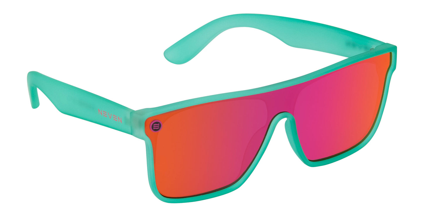 Neven Eyewear X XL: Oversized sunglasses with thick, translucent turquoise frames and wide rectangular, reflective reddish-pink UV-protected lenses. Curved arms show "NEVEN" in white on the left arm.