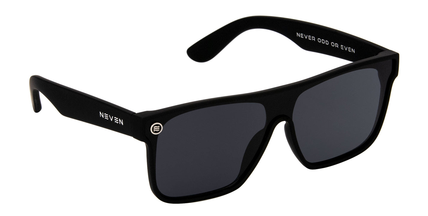 A pair of Neven Eyewear Bold sunglasses in matte black, featuring rectangular frames, UV400 dark lenses, “NEVEN” on the left arm, “NEVER ODD OR EVEN” inside the right arm, and a round logo by the left lens.