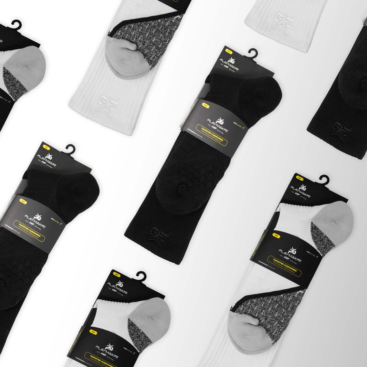 Flat lay of several AMP Ankle Compression Socks packs by iReliev, arranged diagonally on white. Each pack includes three pairs—black, white, and gray—in assorted textures and patterns. Packaging displays the iReliev logo and color-coded labels.