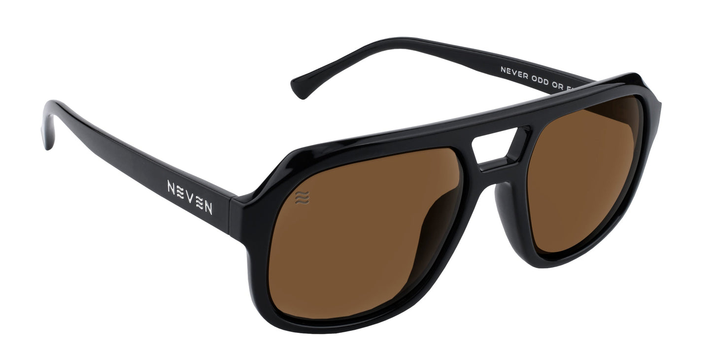 The Gaia by Neven Eyewear are black frame, brown lens sunglasses with a bold angular design and a small nose bridge gap. "NEVEN" is printed in white on the left temple and inside the right arm. Features polarized UV400 eye protection.