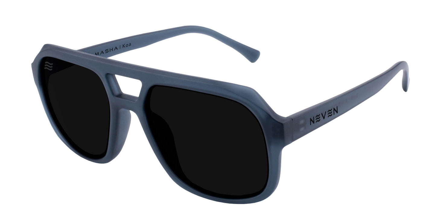 The Neven Eyewear Koa sunglasses from the Masha collection feature a gray, oversized aviator design with thick frames, double bridge, and black polarized UV400 lenses. "NEVEN" is on the right arm; "MASHA | K39" on the left inner arm.