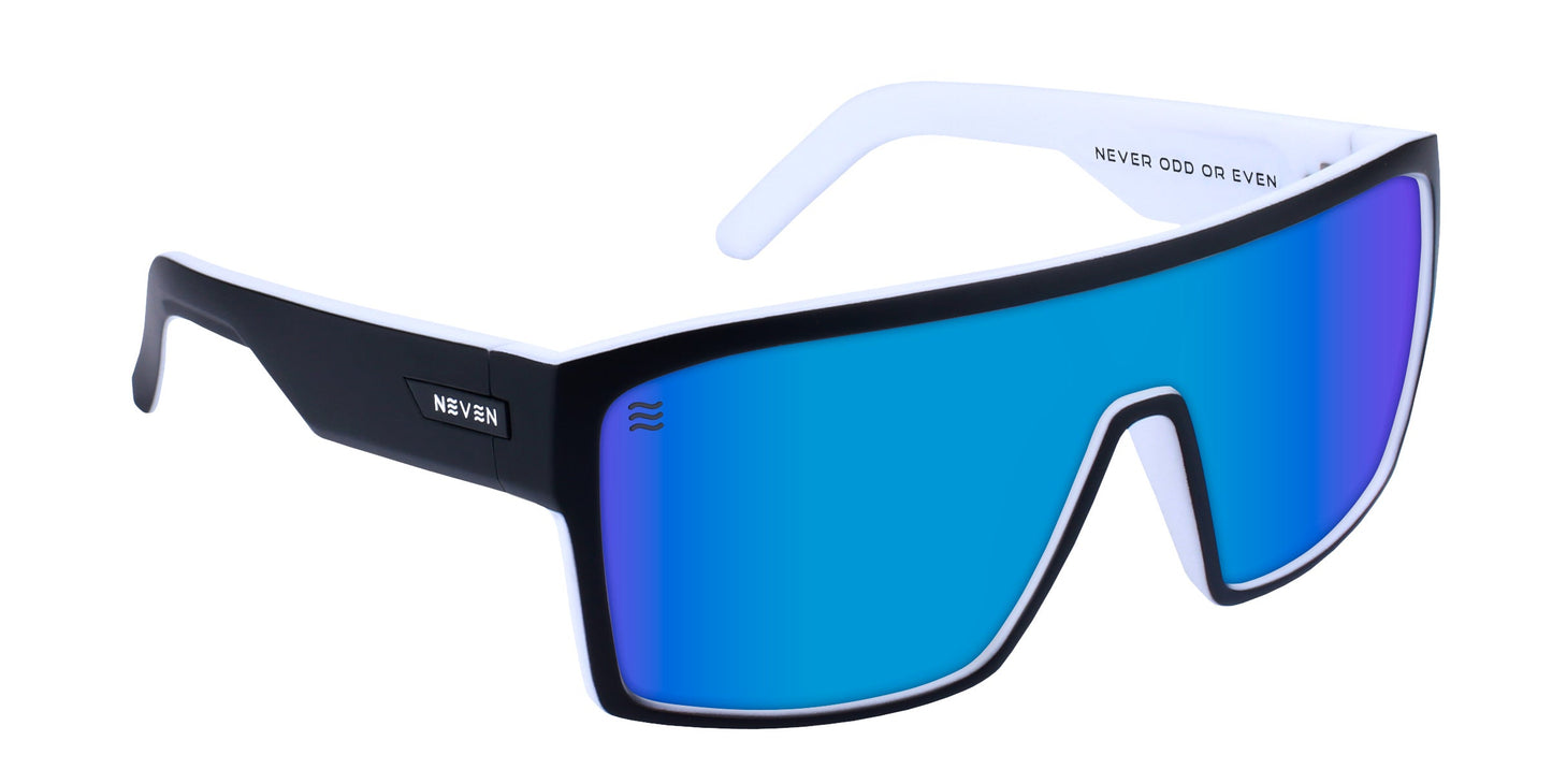 Spanish House sunglasses by Neven Eyewear feature a single blue mirrored UV400 polarized shield lens, thick black frames, “NEVER” branding, and “NEVER ODD OR EVEN” printed on the inner right temple. Inspired by Space Coast surf.