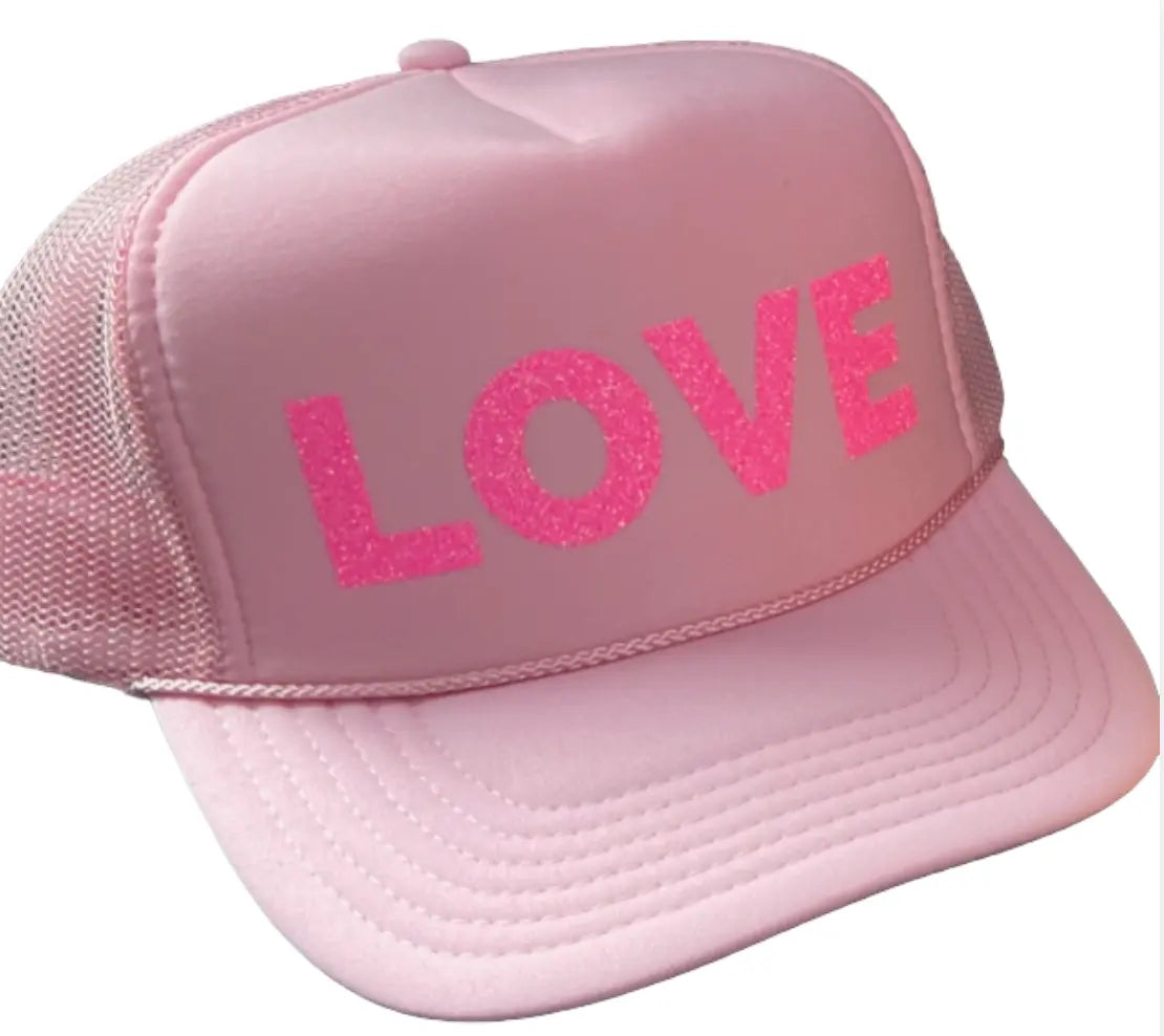 The LOVE Trucker Hat - Pink on Pink by Runway Athletics features pink text, breathable mesh for comfort, and excellent sun protection.