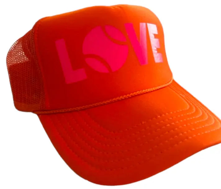 The Runway Athletics LOVE Trucker Hat - Orange & Pink features bold pink “LOVE” lettering with a tennis ball “O,” a curved brim for sun protection, and breathable mesh sides for comfort.