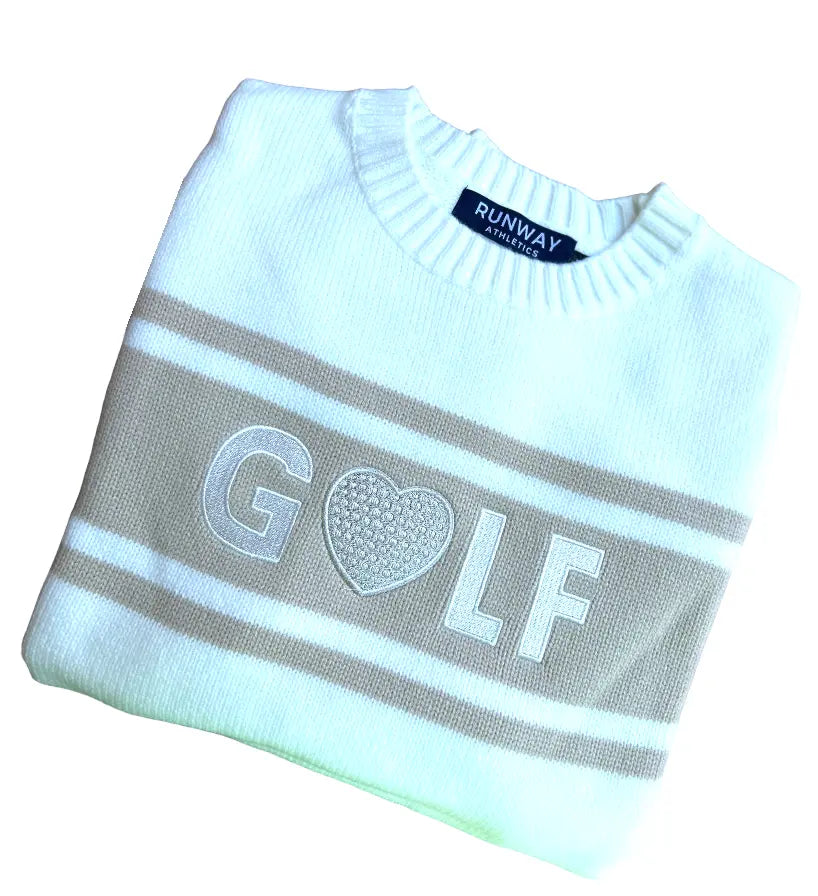 The Golf Sweater - Camel & Off White by Runway Athletics offers a relaxed fit and features a golf logo, crafted from an acrylic weave for comfort and style.