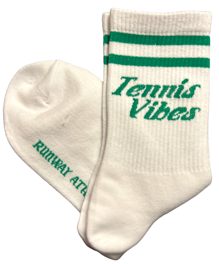 The Tennis Vibes Socks - Green/White by Runway Athletics are 3/4 length white athletic socks with green stripes, "Tennis Vibes" in green on one sock, and "RUNWAY ATTACK" on the sole, made from breathable cotton for comfort.