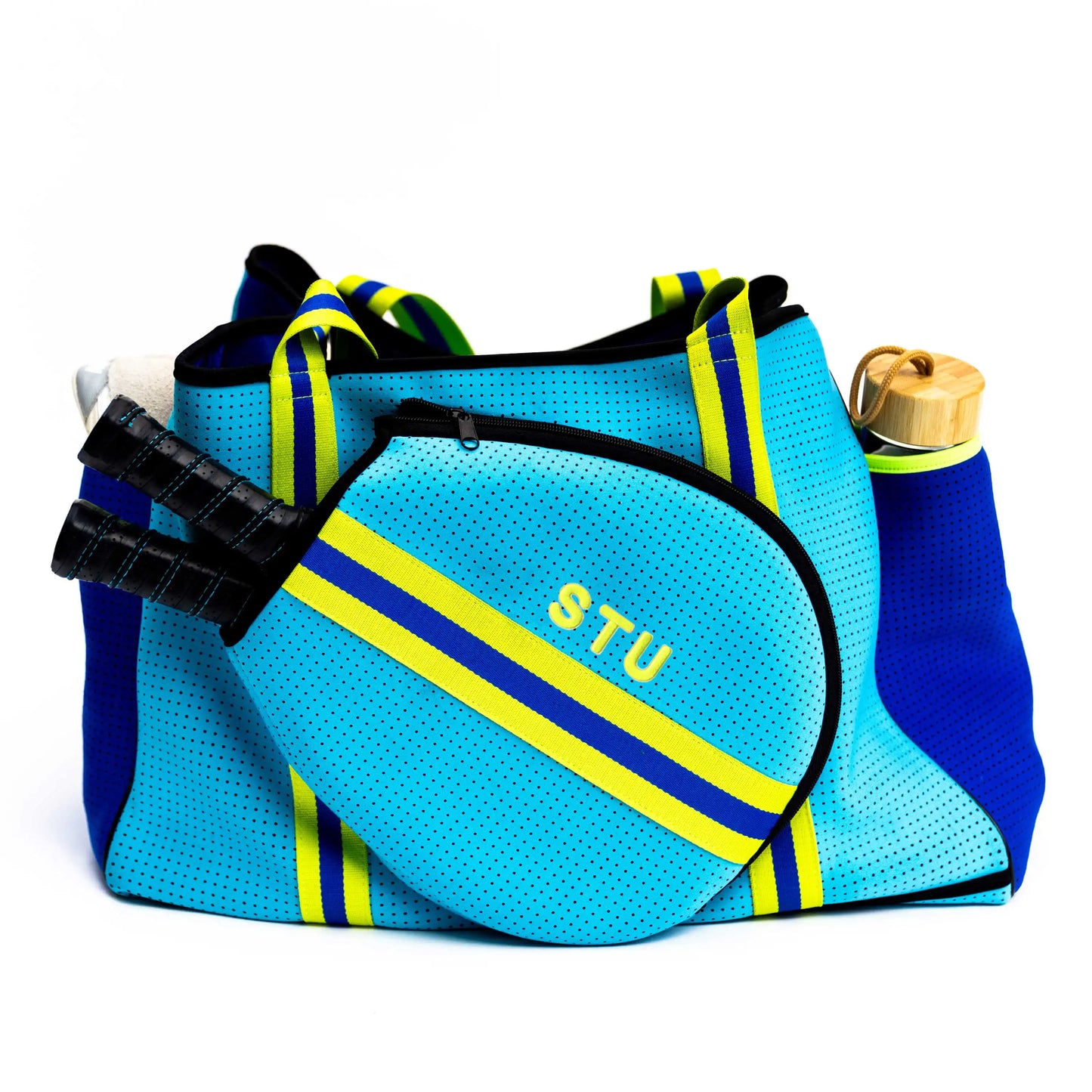 The Swinton Pickleball XL Pickleball Tote Bag - Blue features yellow and green stripes and holds a matching blue paddle case labeled STU, two black-handled paddles, a tan water bottle, and a white towel on a white background.
