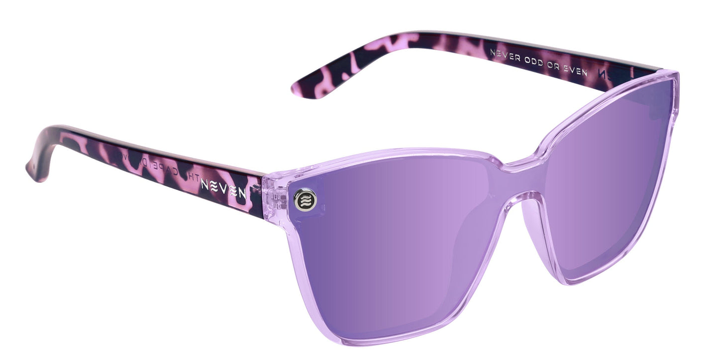 A pair of Neven Eyewear Discovery sunglasses with large angular polarized UV400 lenses, translucent purple frames, pink and black marbled arms, and "NEVER ODD OR EVEN" printed inside the right arm in white.