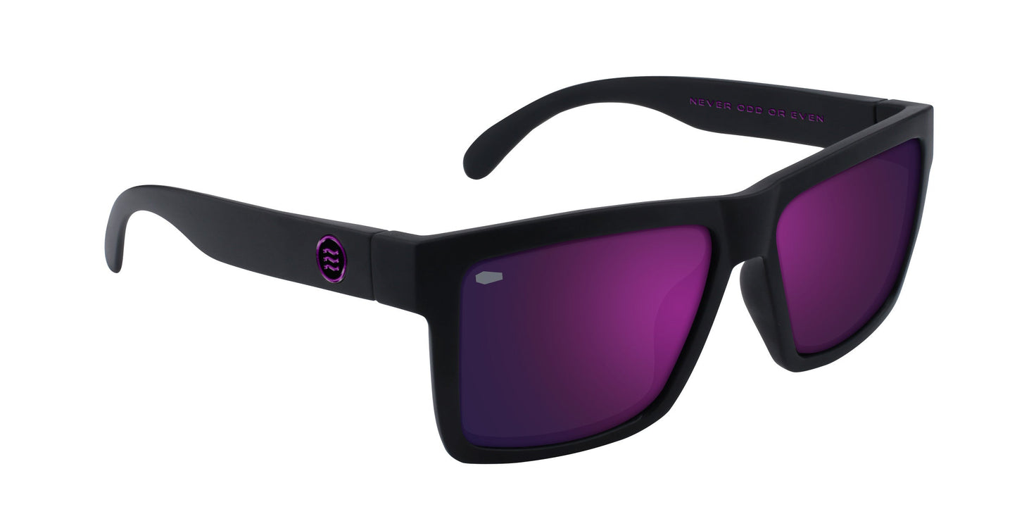 The Nightshade by Neven Eyewear are matte black sunglasses with wide arms, purple mirrored polarized lenses, a small circular logo by the hinges, and a thick frame for a bold, modern gothic look.