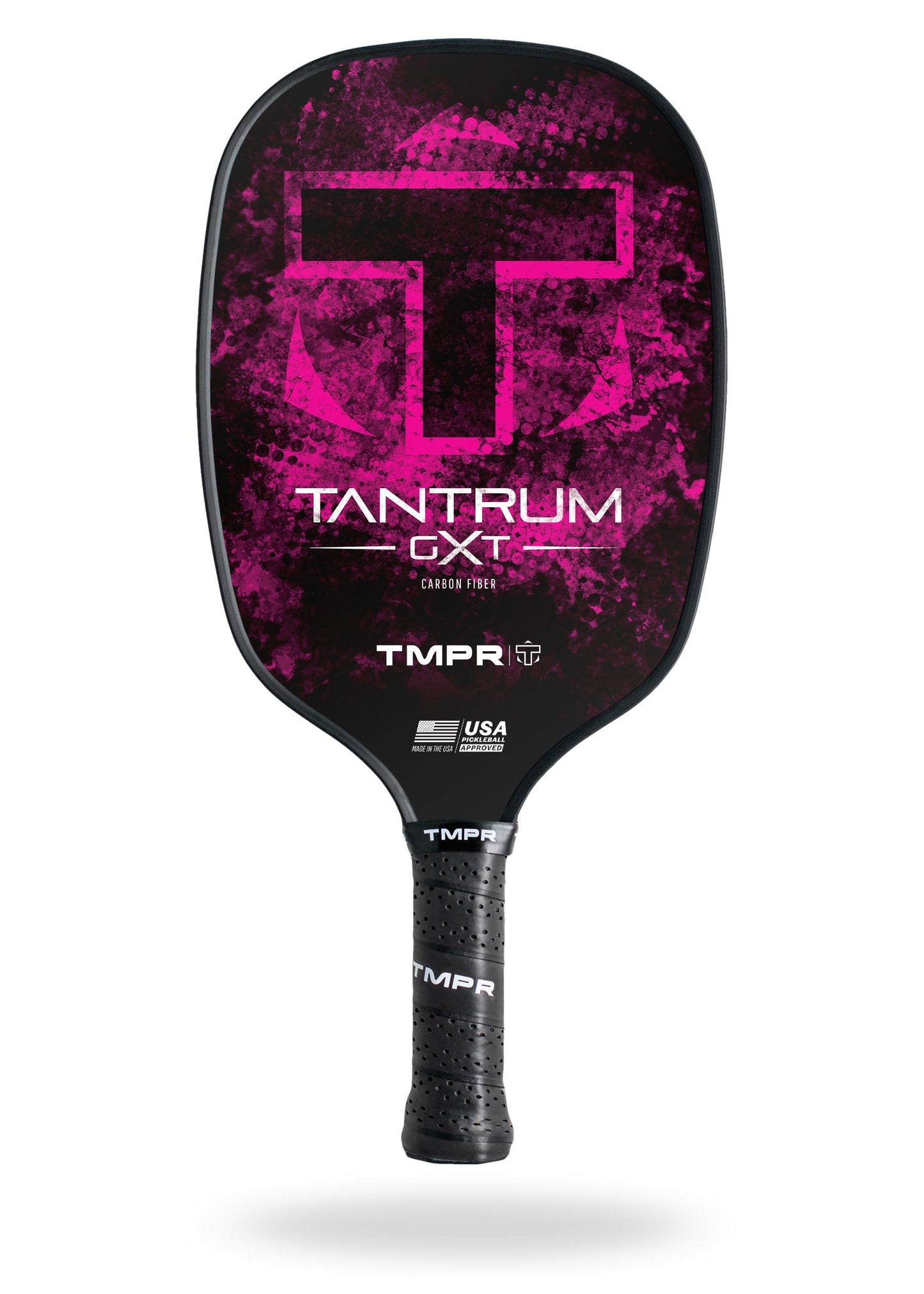 The TMPR Sports Tantrum GXT is a black carbon fiber pickleball paddle with a pink splatter design, large “T” logo, “TANTRUM GXT CARBON FIBER” and “TMPR” in white, USA Pickleball Approved logo, and a textured, vibration-dampening grip.