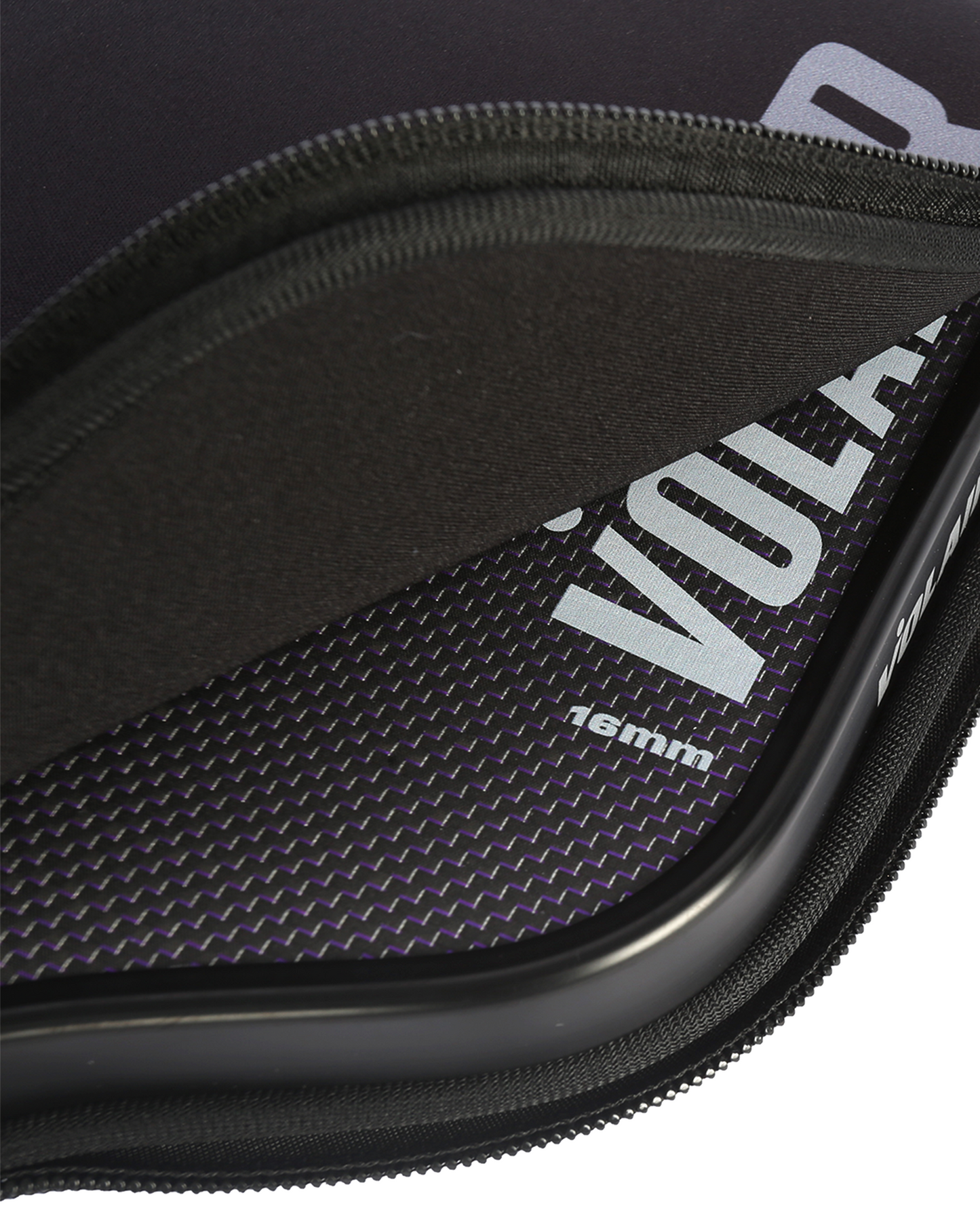 A close-up shows a partially unzipped black case revealing the Volair Pickleball V.1F/XL–W 16mm carbon fiber paddle, with bold white branding, a textured dark surface, and focused zipper and fabric details.