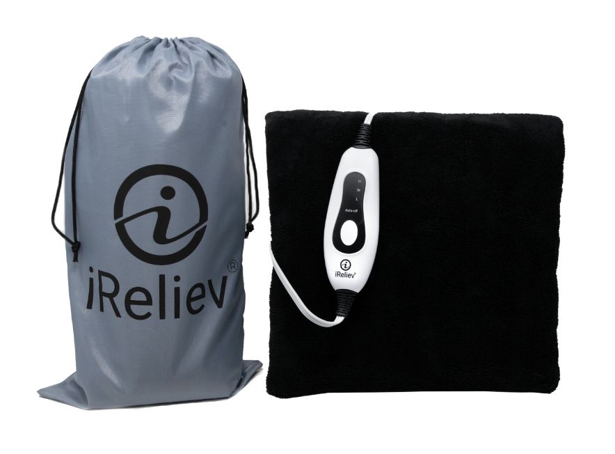 A gray iReliev drawstring bag sits next to the black Weighted Heating Pad with a white wired controller bearing buttons and the iReliev logo, all displayed against a plain white background.