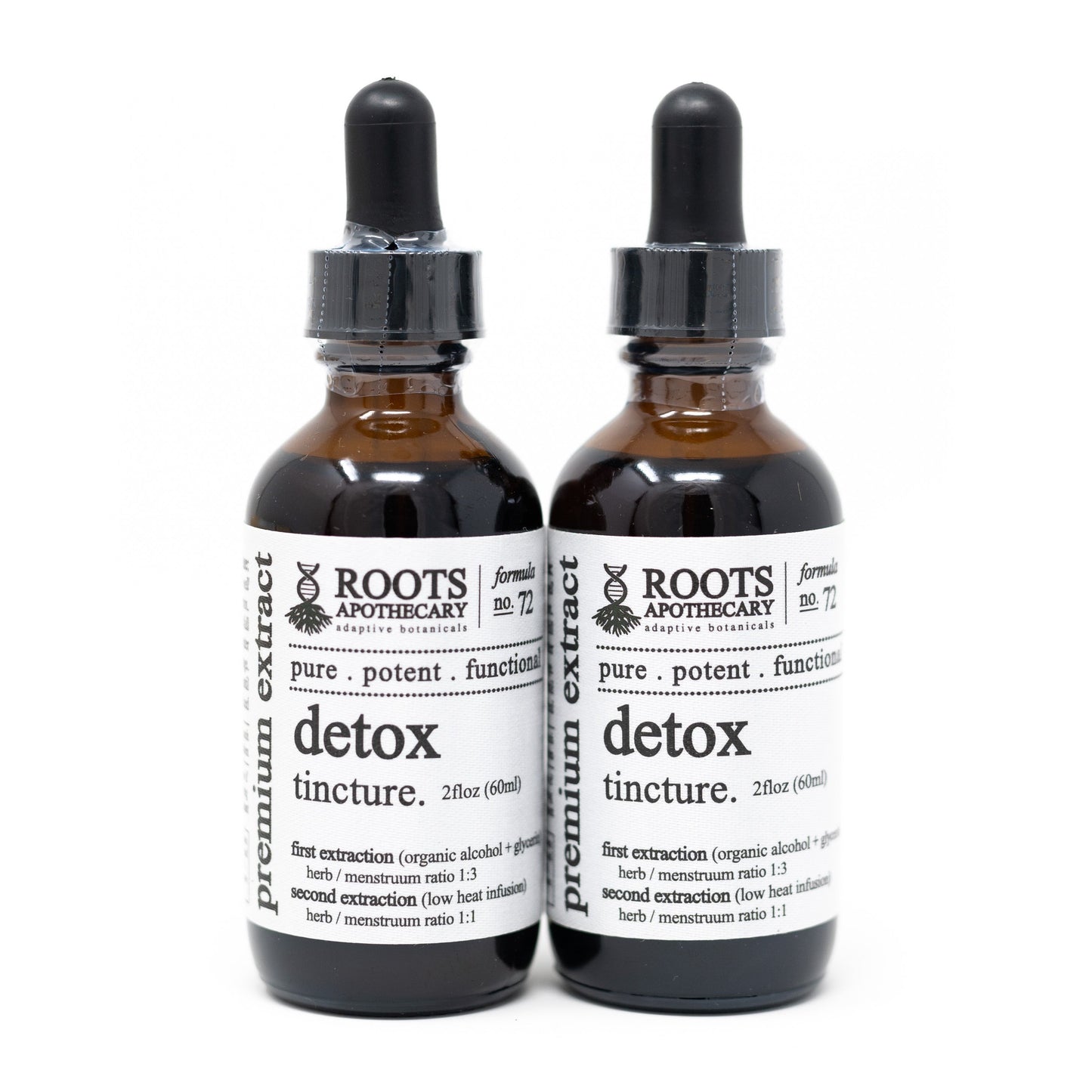 Two brown glass dropper bottles of Roots Apothecary detox tincture stand side by side on a white background, highlighting a pure, potent herbal cleanse with dosage and ingredient details on the labels.