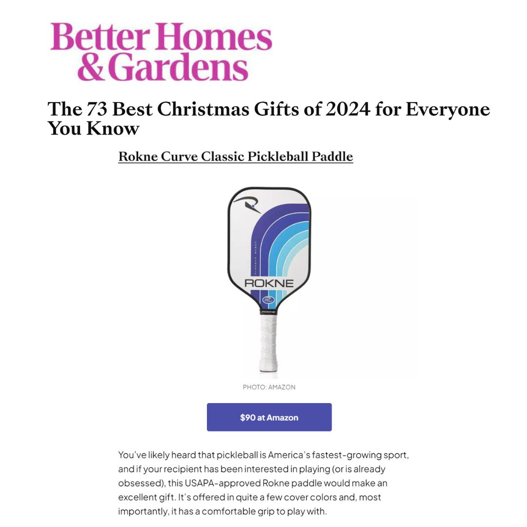 A screenshot from Better Homes & Gardens titled “The 73 Best Christmas Gifts of 2024,” featuring the ROKNE CURVE CLASSIC ORIGINAL pickleball paddle in blue, purple, and white, with PROGrit texture and honeycomb core, priced at $90.