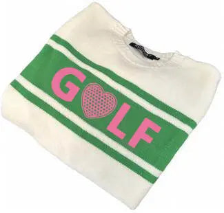 The Golf Sweater - Pink, Green & Cream by Runway Athletics features two green stripes and "GOLF" in pink letters across the front, with the O as a pink polka-dot heart. The sweater is preppy, folded, and white.