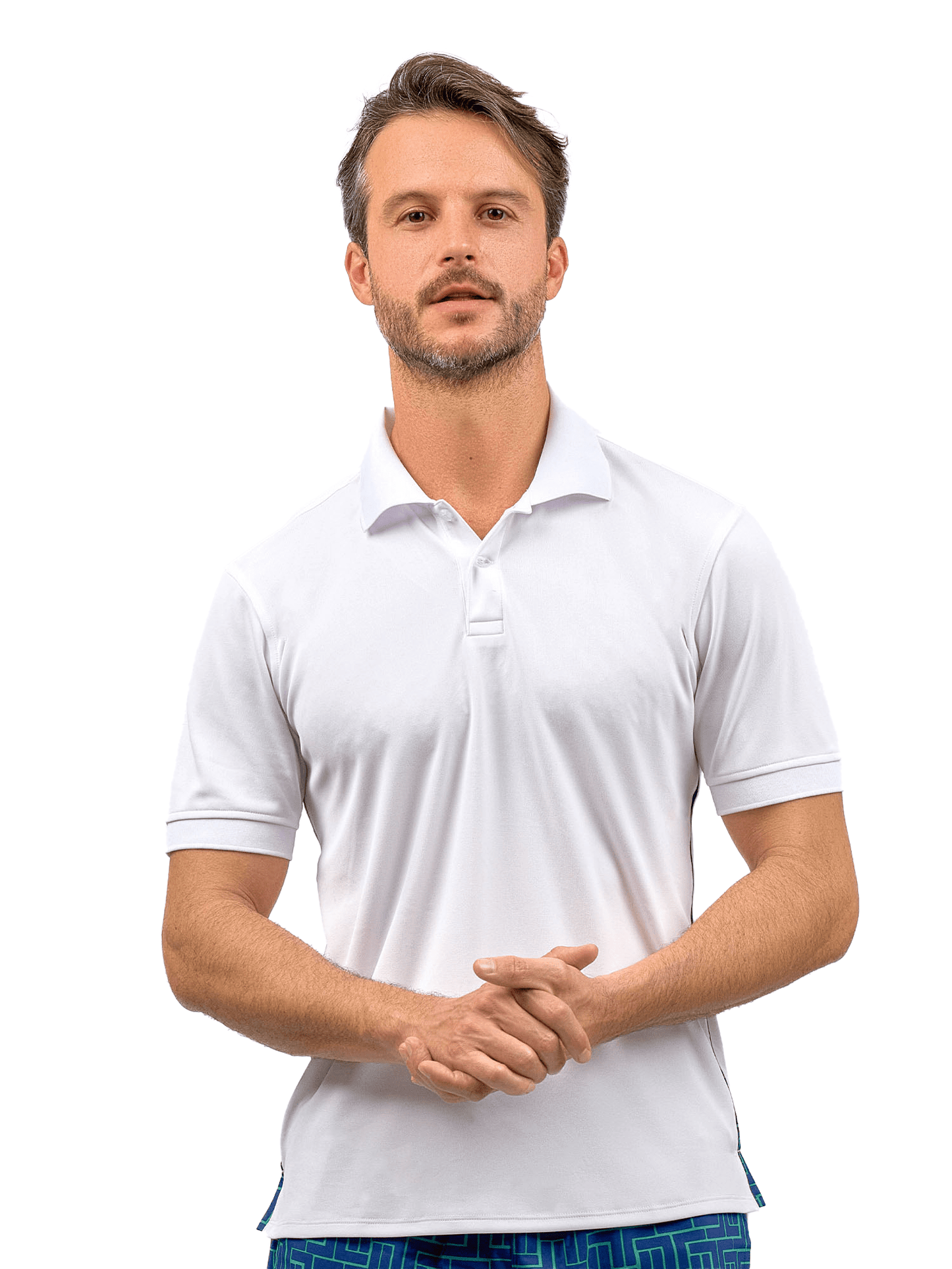 A man with short brown hair and a trimmed beard wears the inPhorm NYC Men's Spin Polo shirt, a performance shirt for tennis & golf, paired with blue patterned shorts. He stands against a white background, facing forward with a neutral expression.
