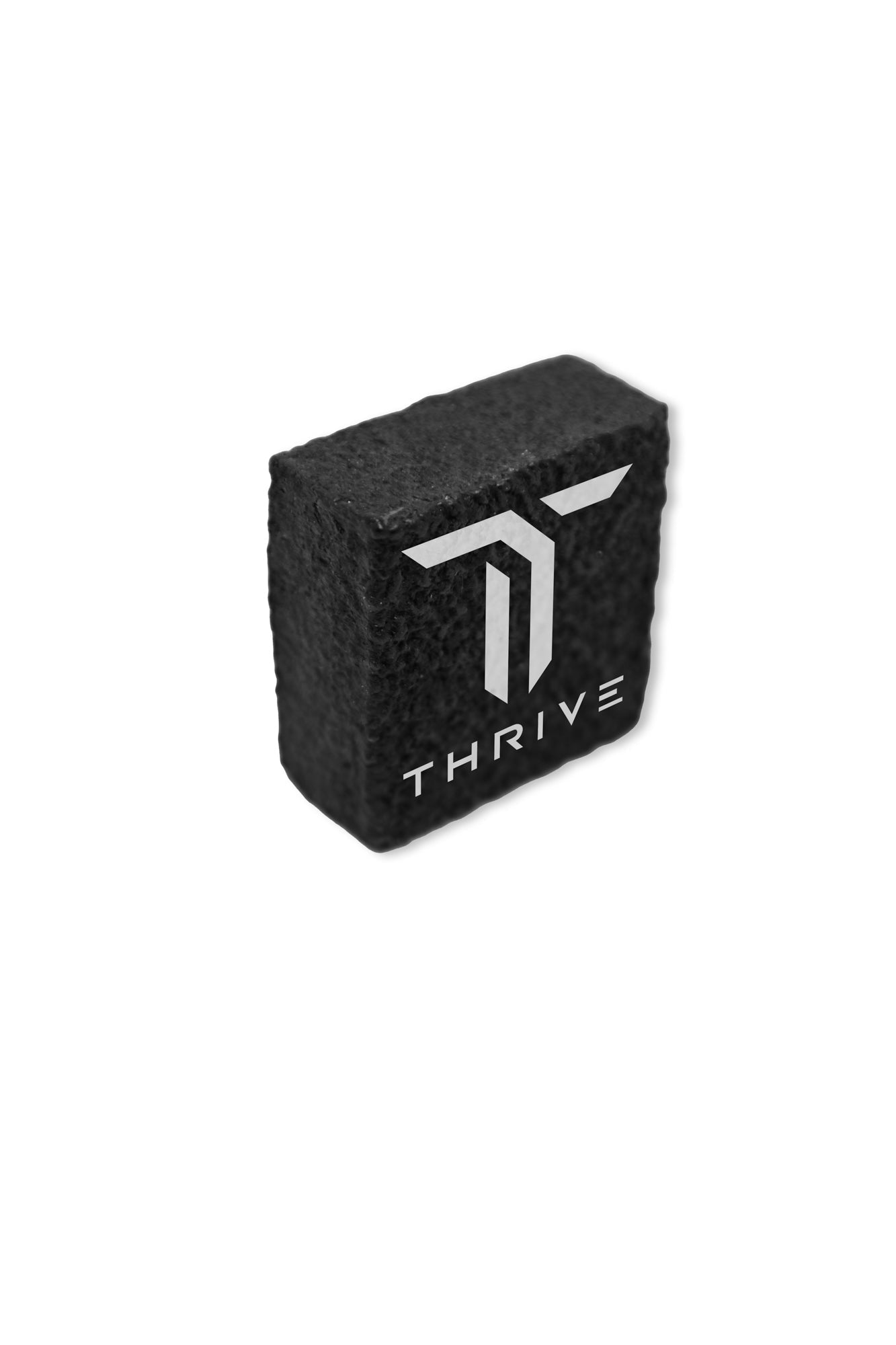 A black rectangular Paddle Eraser from Thrive Pickleball, with a textured surface and a white geometric T logo above "THRIVE," is centered on a plain white background, highlighting its minimalist design.
