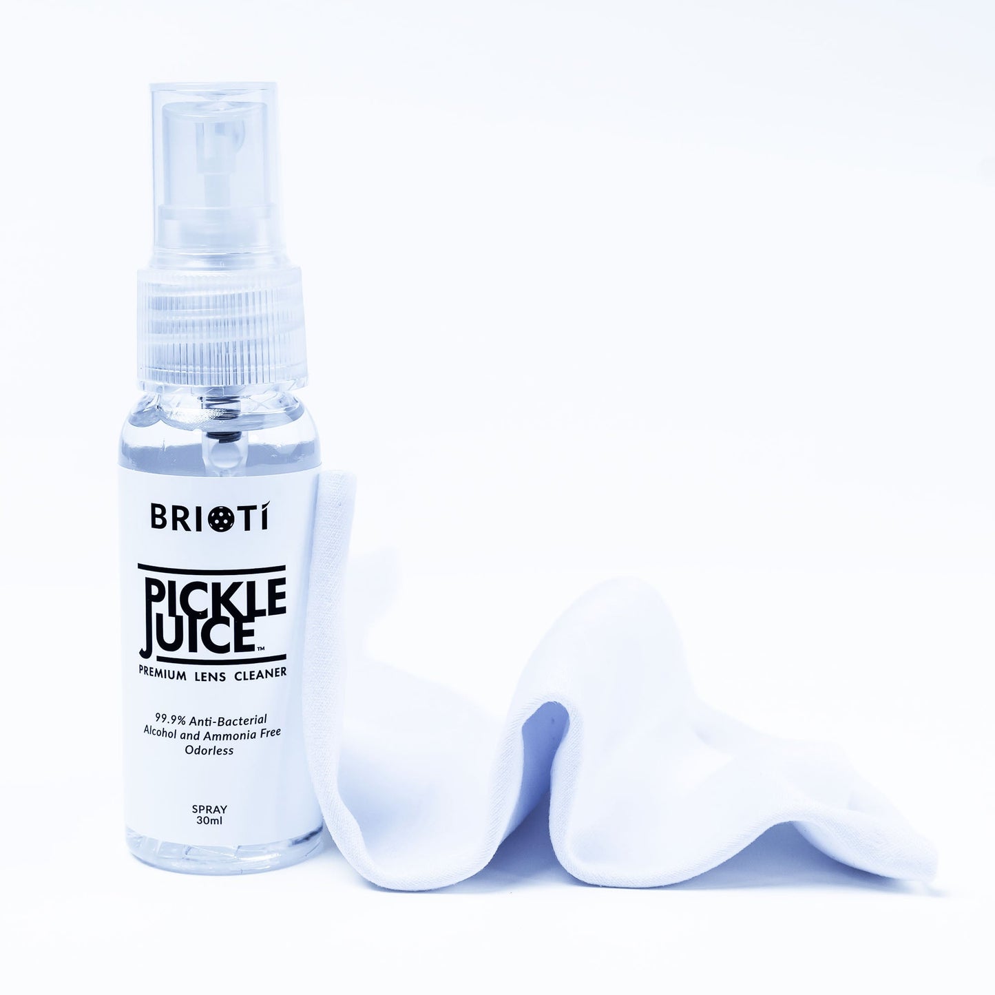 A clear spray bottle labeled “PICKLE JUICE™ Cleaning Kit” by BRIOTI stands upright beside a soft white cloth. The 50ml fine mist spray provides a streak-free clean, both items displayed against a crisp white background.