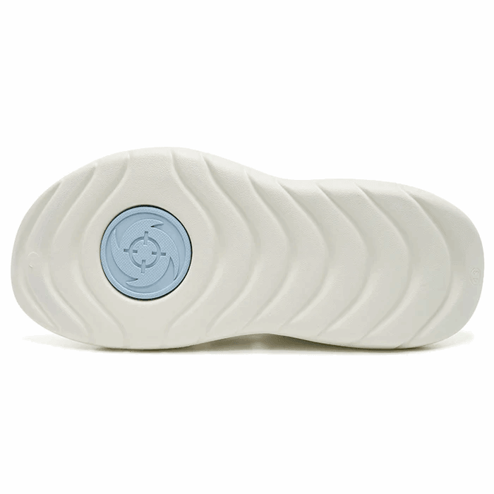 The image shows the white outsole of BPBazaar Rigorer Shark 3 Slides 'White/Pink/Blue', with wavy grooves and a blue geometric-patterned heel section. The rubber-foam build offers excellent grip and comfort for all-day wear.