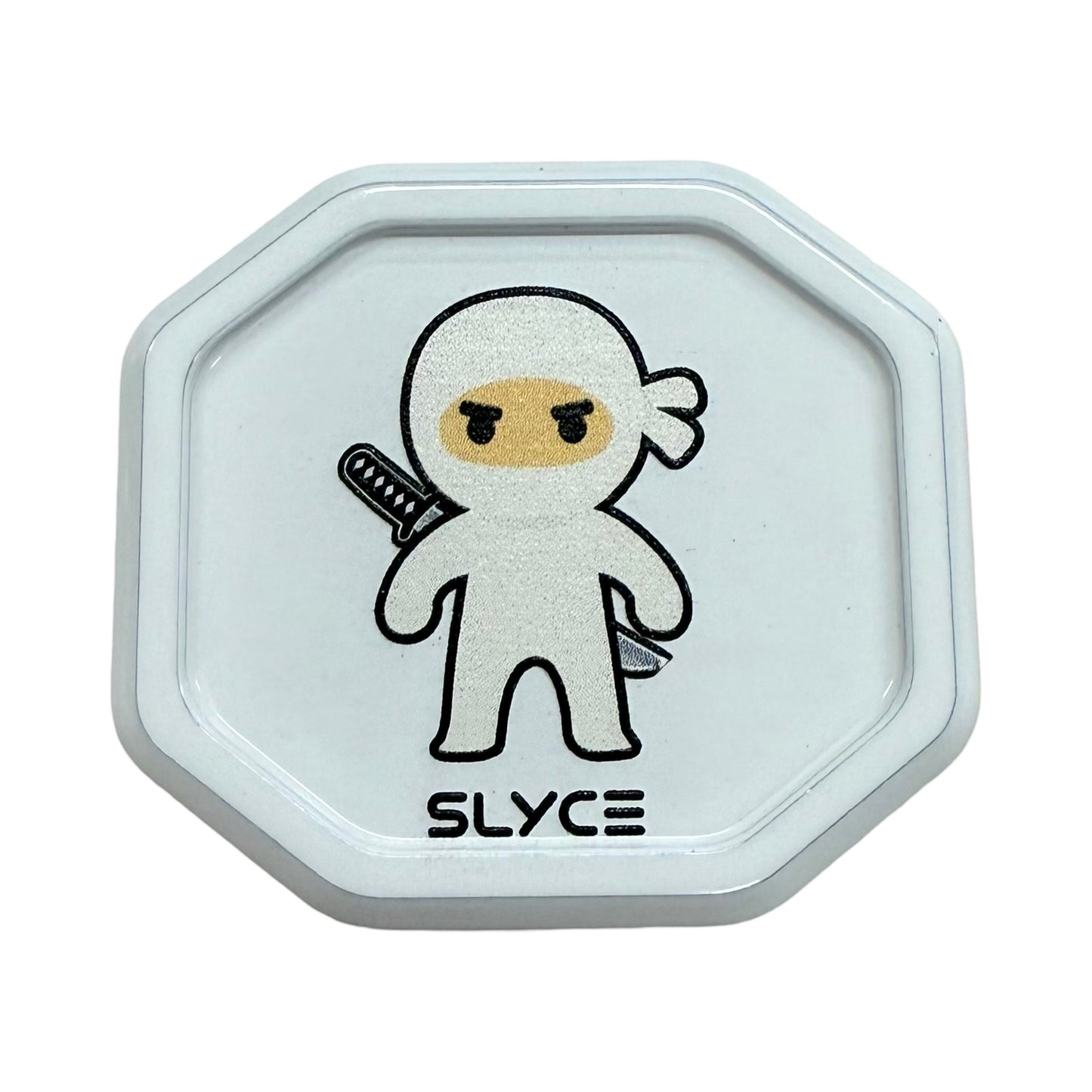 The Special Edition Dink Ninjas SpeedCap (28g, 1.0 oz.) by Slyce Sport is a white octagonal replacement grip cap featuring a cartoon ninja with a sword and "SLYCE" in bold black letters on a plain white background.