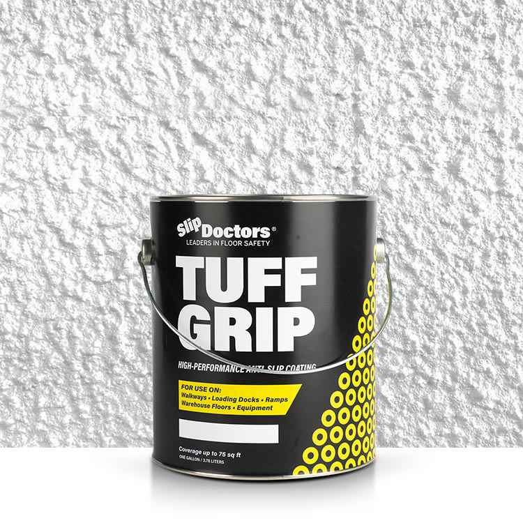 A black one-gallon can of SlipDoctors Tuff Grip Aggressive Traction Non-Skid Floor Paint rests on a white textured surface, featuring bold black, white, and yellow labeling with a yellow circle design and metal handle.
