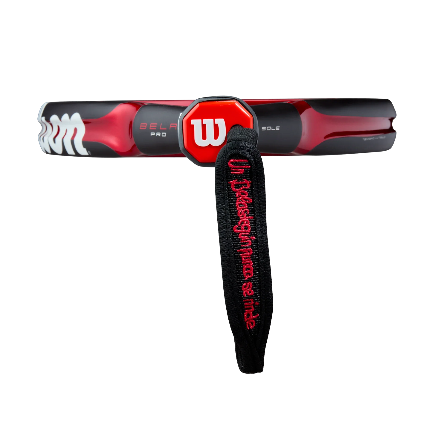 A close-up of the Wilson Bela Pro V3 Padel Racket handle by Padel USA features a black and red color scheme, a red Wilson logo, and a black strap with “Unleash your ultimate side” embroidery against a white background.