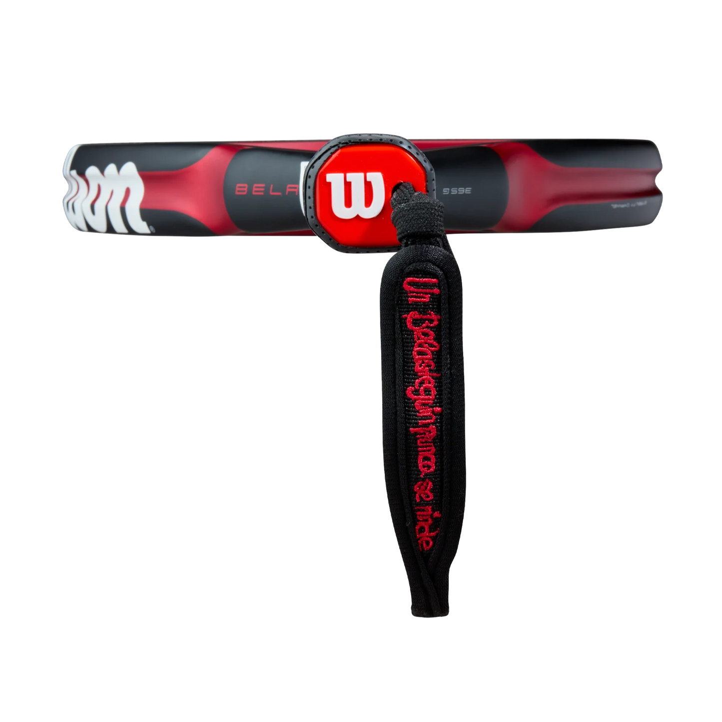 The Wilson Bela V3 Padel Racket from Padel USA features a black and red handle with a red Wilson W logo, plus a black wrist strap with "Unleash your fierce pride" embroidery. Its 24K carbon face stands out against a white background.