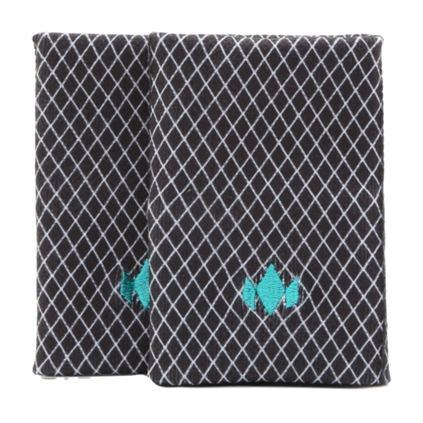 A pair of black and white books alongside Diadem Sports’ ultra-thin 4.5" DryCore Wristbands for stylish, everyday convenience.