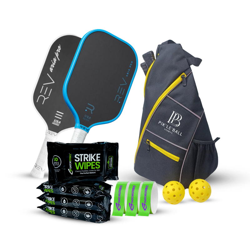 A pickleball set with two paddles, a gray and yellow bag, four packs of Strike wipes, two yellow balls, and three green overgrips arranged on a white background.
