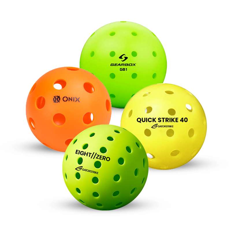 Four perforated plastic pickleballs are shown: one orange, one light green, and two yellow, each featuring different brand names and logos in black text on their surfaces.