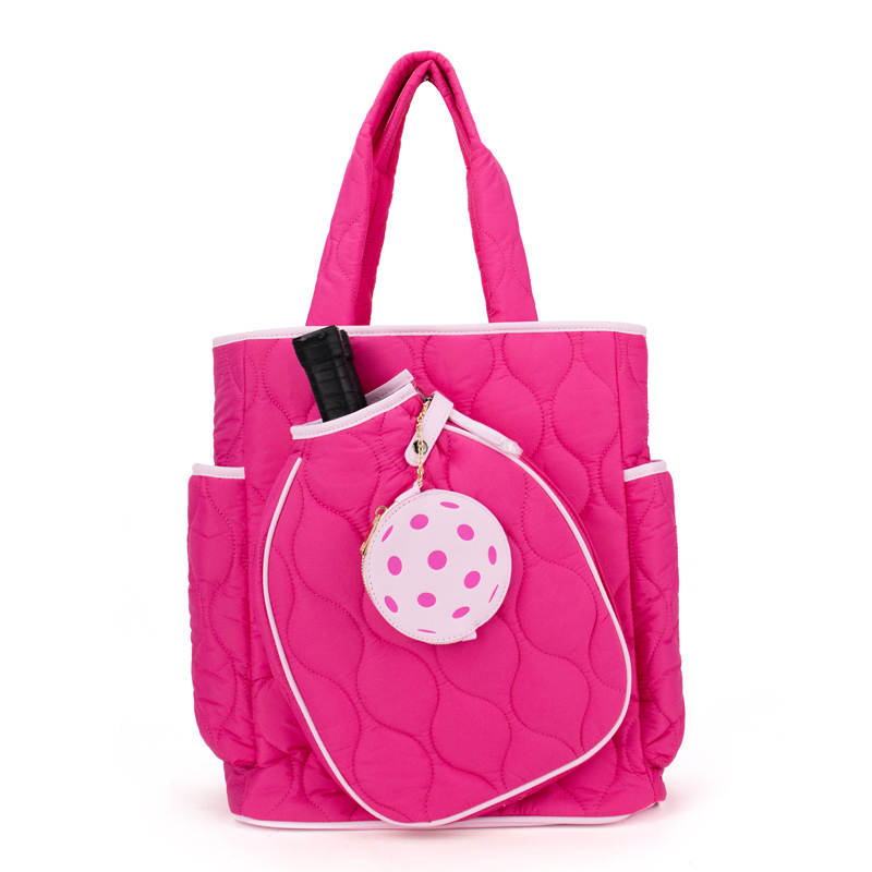 The Queen of the Court Fifth Ave Pickleball Convertible Tote Bag/Backpack in pink combines style and function, letting you carry all your gear easily while standing out on and off the court.
