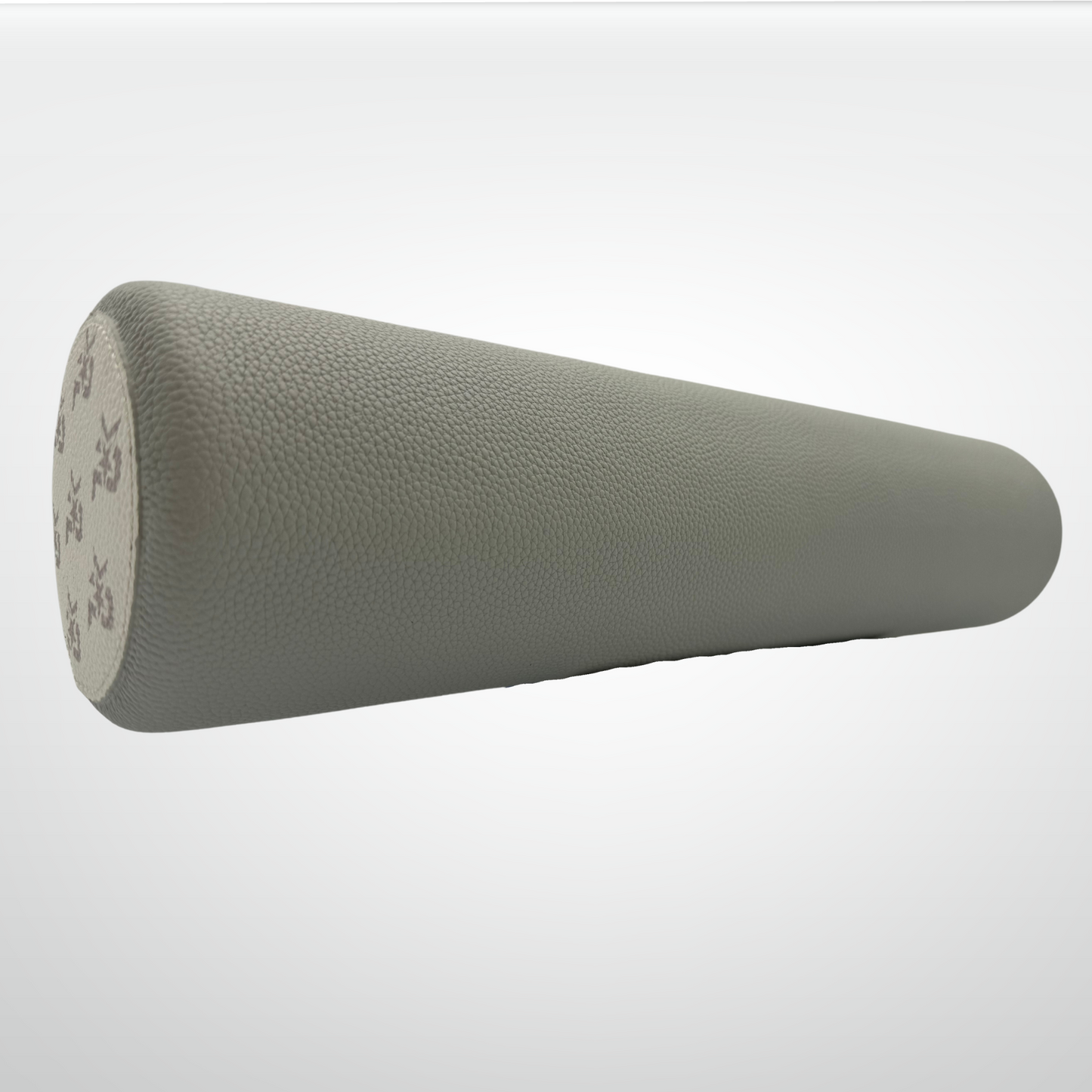 The iReliev I AM Leather-Wrapped Cork Stretching and Massage Roller is a cylindrical roller with a textured surface, shown on its side against a white background, featuring an end cap with a subtle gray floral pattern.