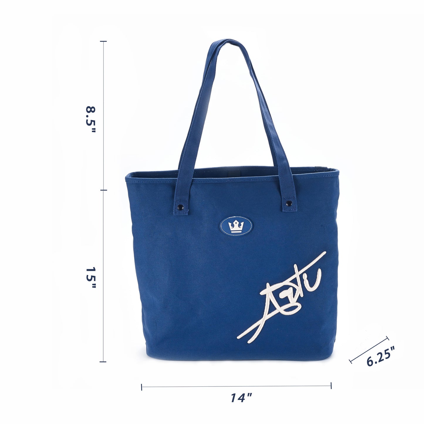 The ARTI Navy Tote Bag is an eco-friendly cotton tote with two handles, a small crown emblem, large white script, and measures 15"H x 14"W x 6.25"D with 8.5" handle height. Brand: ARTI.
