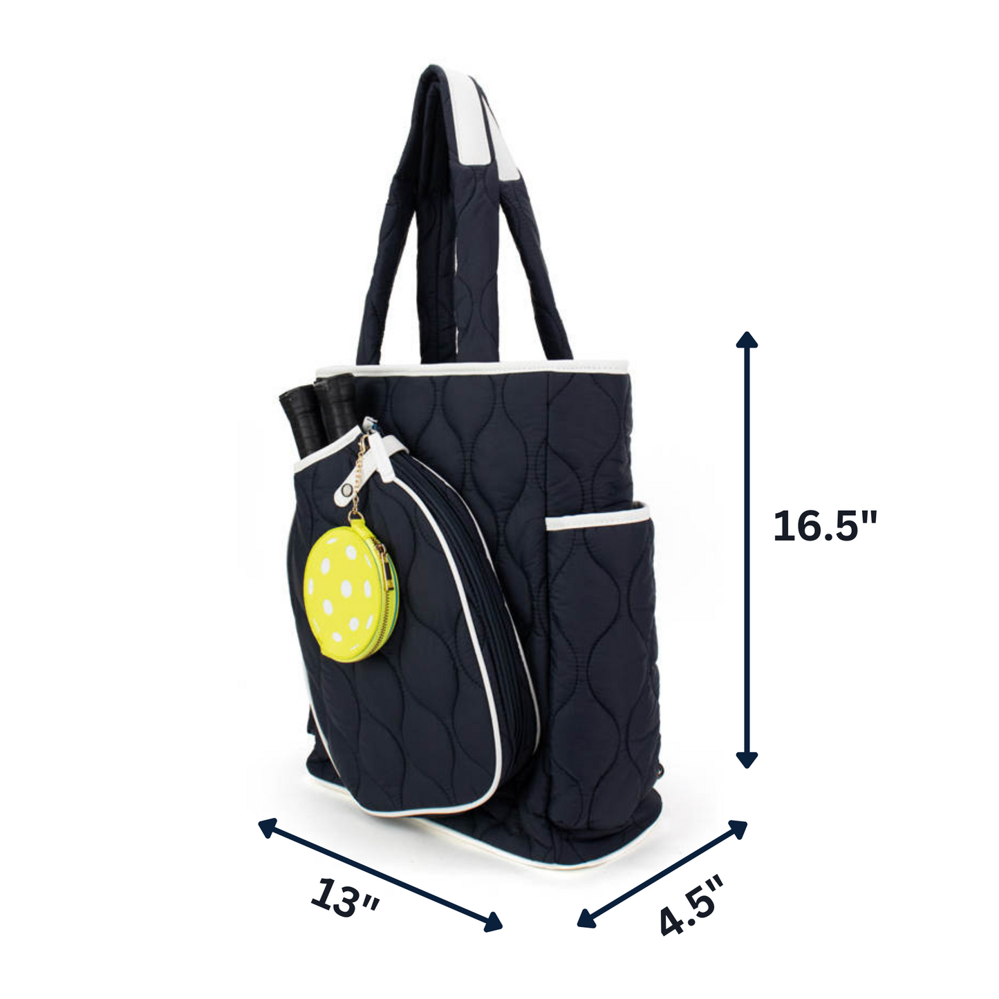 The Queen of the Court Fifth Ave Pickleball Convertible Tote Bag/Backpack features navy quilting, white trim, two handles, side pockets, a green polka-dot pouch, and fits two racquets. Size: 16.5" tall x 13" wide x 4.5" deep.