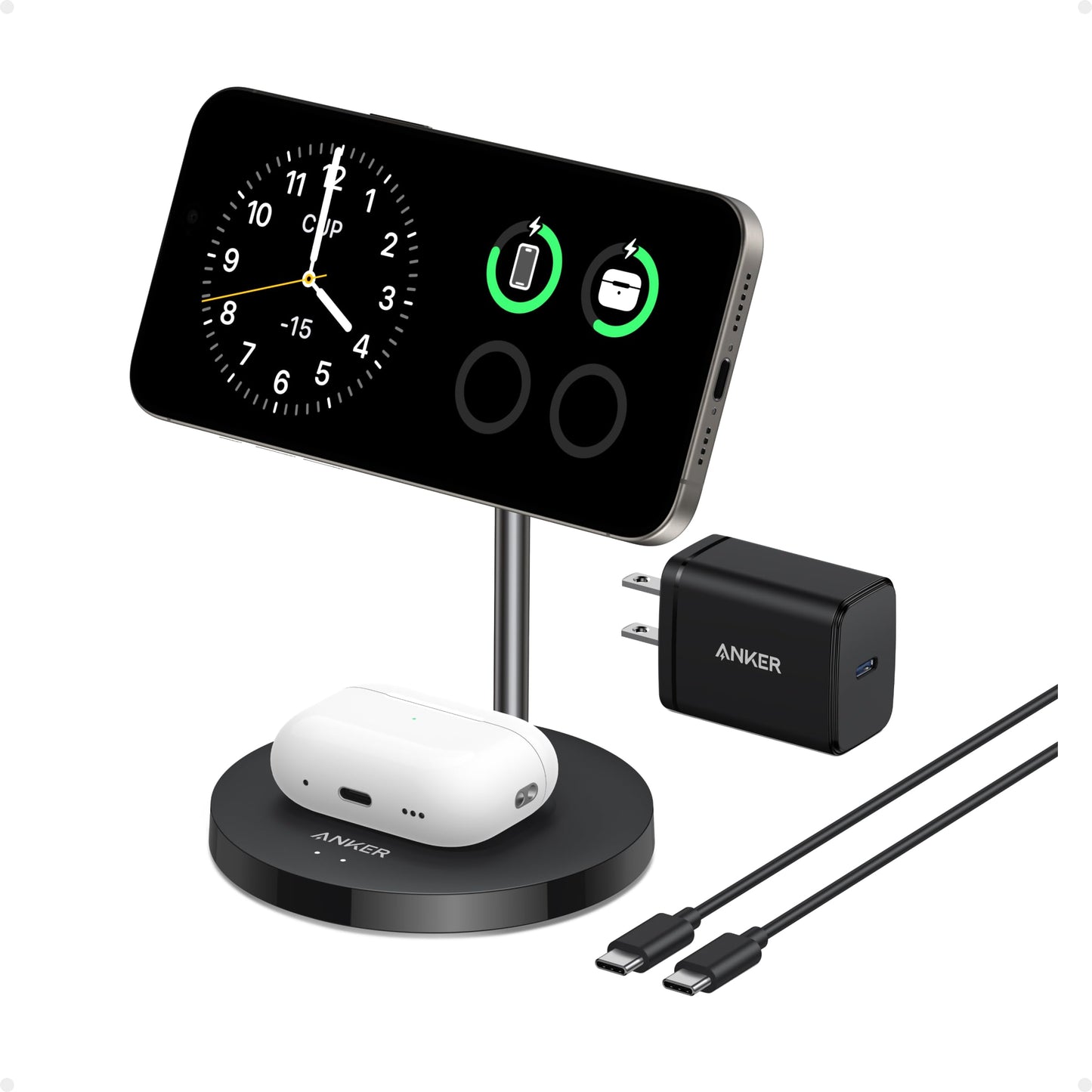 An Anker MagGo Wireless Charger (2-in-1 Stand) BOA holds a smartphone showing clock and battery icons, with wireless earbuds on the base. Next to the 15W fast charger are a black Anker wall charger and a USB-C to USB-C cable.