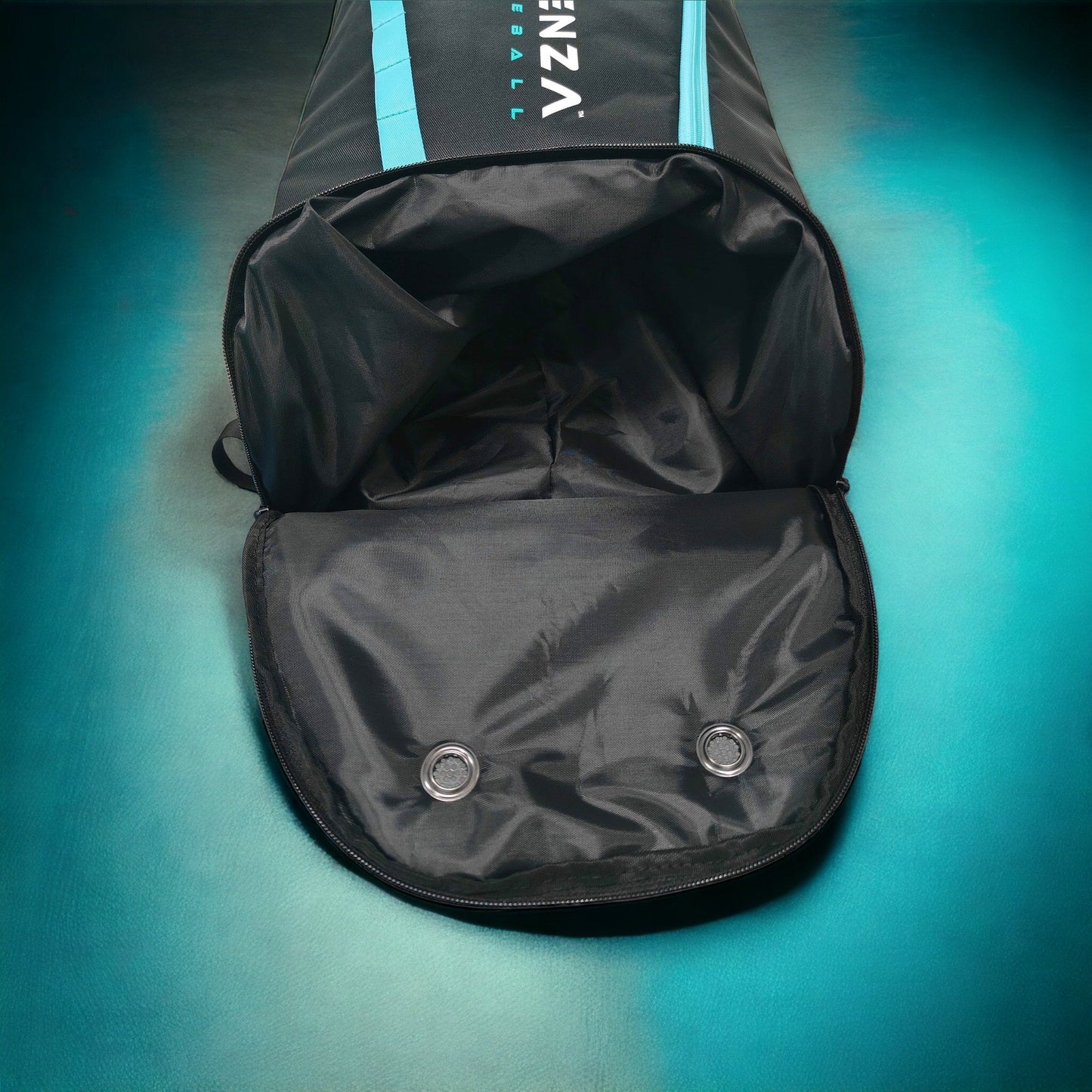 A black Potenza Pickleball Pro Player Logo Bag (holds 4-5 paddles) with blue stripes sits upright on a teal background, unzipped to display its spacious interior and two metal grommets on the inside flap.