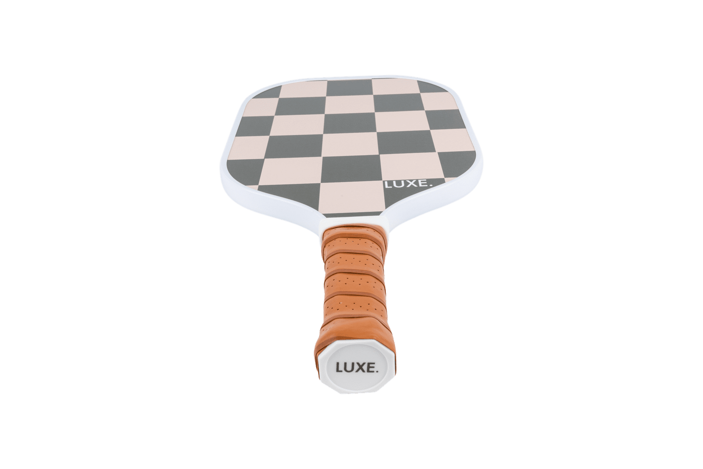 A USA Pickleball Approved paddle by LUXE Pickleball, Checkmate features a brown perforated grip and a black-and-tan checkerboard textured face. “LUXE.” is printed in white on the face and grip end. The background is solid white.