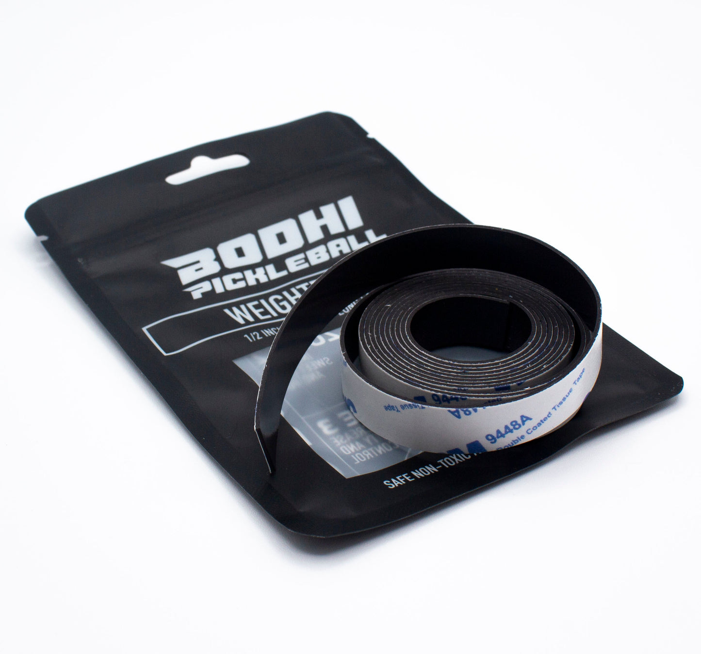 A roll of black PROtune™ Weighted Tape by Bodhi Performance, partially unspooled, rests on its black resealable packaging. The package notes the paddle tape is 1/2 inch wide and safe for high and low temperatures.