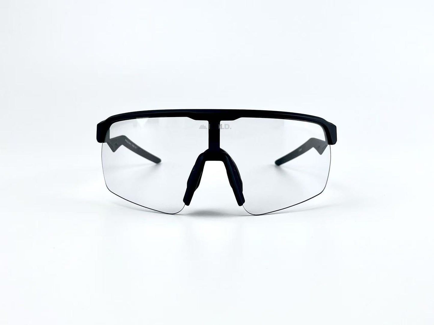 The BOLD Flash Photochromic Sunglasses by boldouterwear feature a black frame, single wraparound lens, and nose pads. Displayed on a white background, these MTB, ski & lifestyle sunglasses showcase a sleek, angular design facing forward.