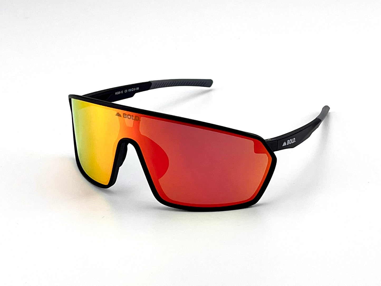 The BOLD NSP Performance Sunglasses by boldouterwear feature a single large red-orange mirrored lens, black frame, and modern wraparound design with subtle logos—ideal for smaller faces in MTB, ski, and lifestyle settings.