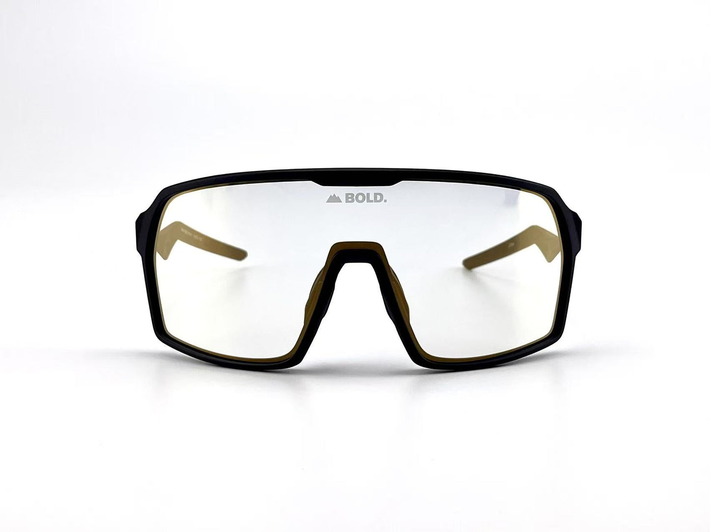 The BOLD Glow Photochromic Sunglasses by boldouterwear feature adaptive wraparound mirrored lenses, a black frame, and "BOLD." with a mountain logo at the lens top center. The plain white background emphasizes their sporty style.