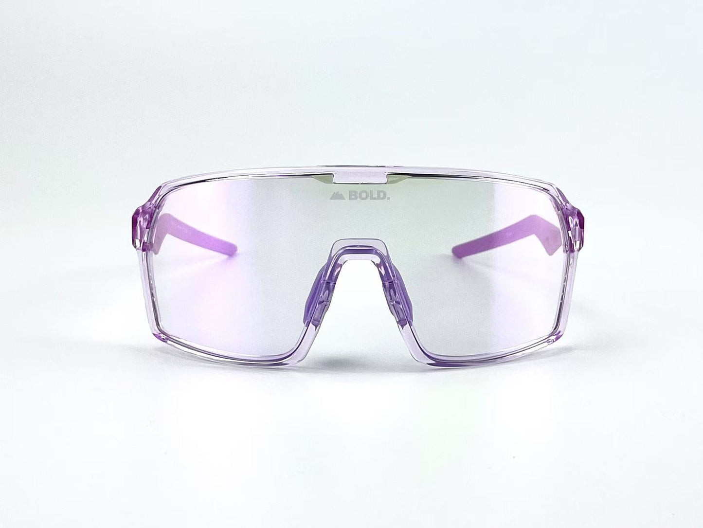 The BOLD Glow Photochromic Sunglasses by boldouterwear feature oversized, translucent purple frames with thick rims and non-polarized lenses. "BOLD." appears at the top center of the lens. Purple arms complete the look; background is plain white.