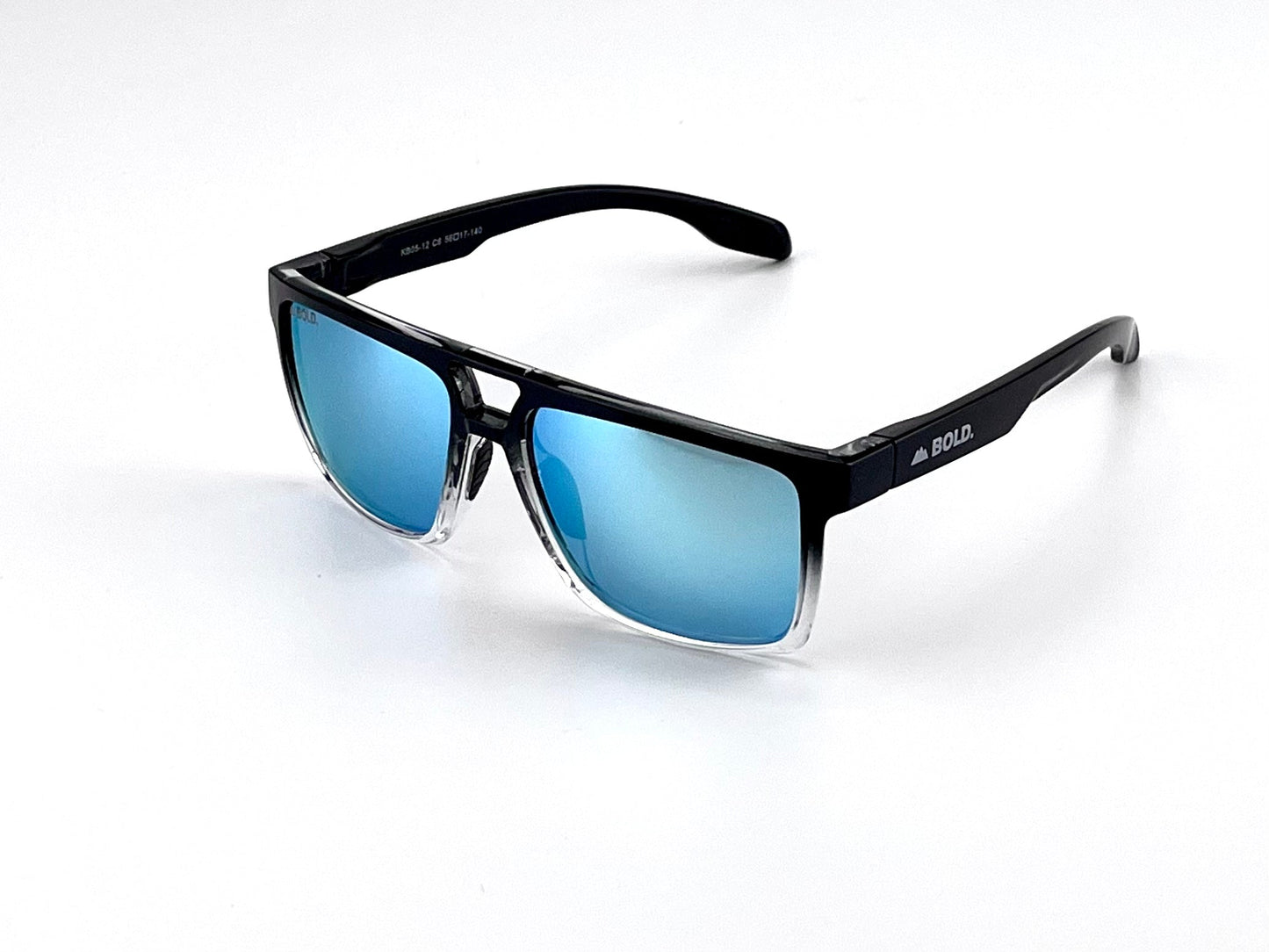 The BOLD Wildhorse Performance Sunglasses from boldouterwear feature black and clear frames, blue mirrored UV-protected lenses, a modern angular design, trail-to-town versatility, and sleek gradient accents. Perfect for MTB, ski, and lifestyle wear.