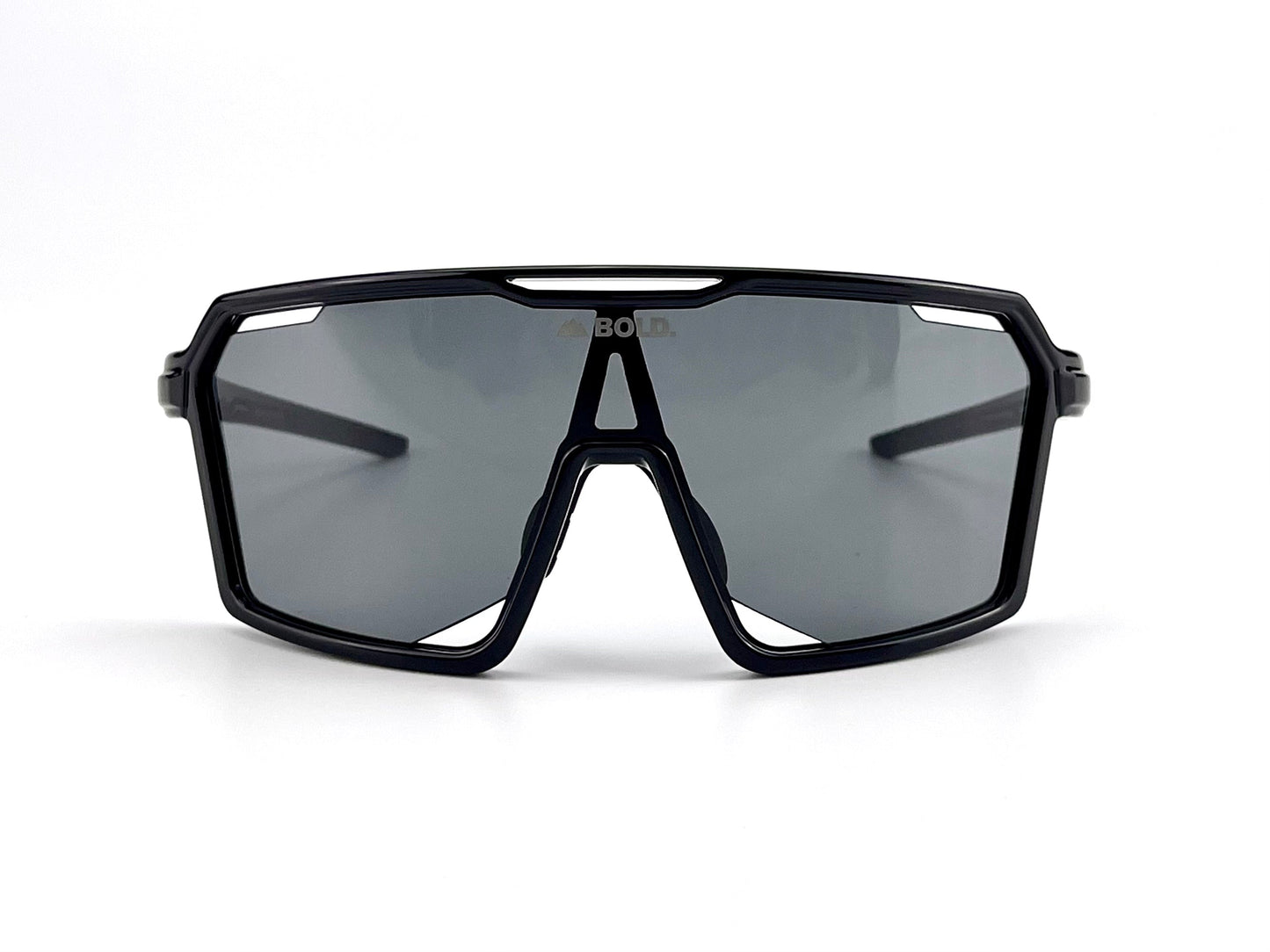 The BOLD Flux Performance Sunglasses by boldouterwear feature a black, angular wraparound design with large single-piece dark lenses and a bold frame, offering modern style and superior UV protection—perfect for MTB, ski, or lifestyle use.